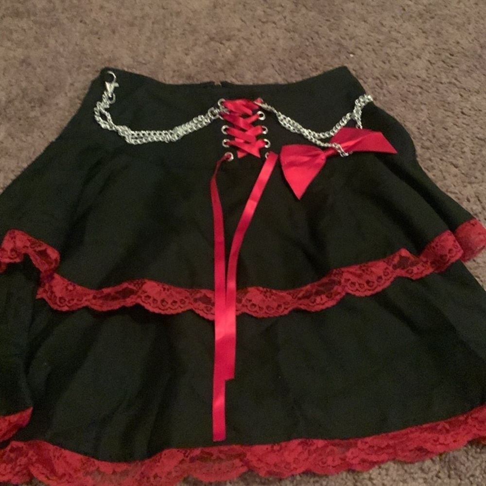 Black skirt with red lace and chains
